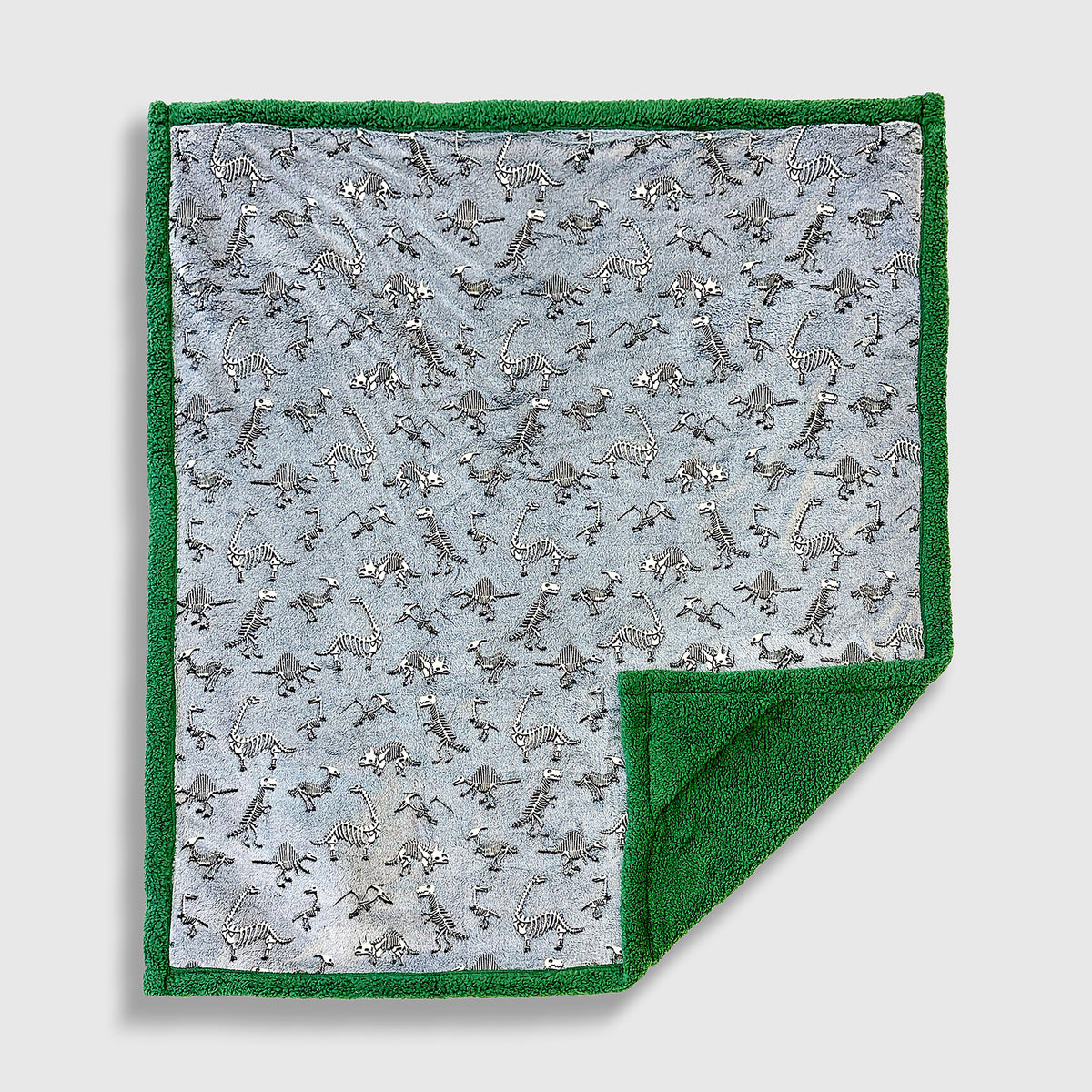 Cozy Switch Blanket – Reversible Sherpa & Glow-in-the-Dark Blanket with Plush Toy Pocket, Glow Dino Bones
