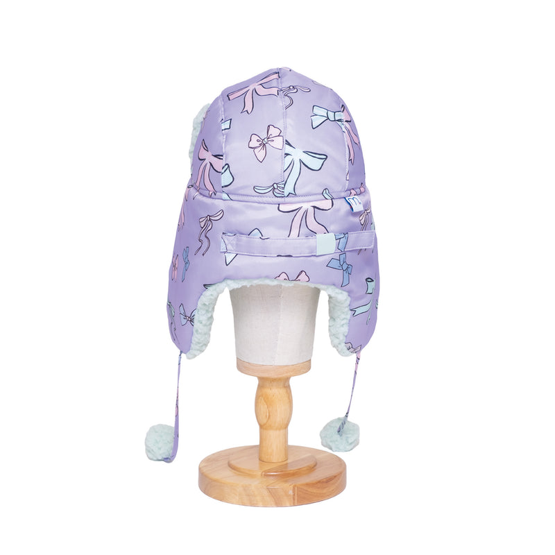 The Cozy Trapper Hat – Bows Print with Pale Aqua Sherpa Liner & Pompoms