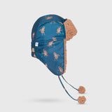 The Cozy Trapper Hat – Skating Sloths Print with Curry Tan Sherpa Liner & Pompoms